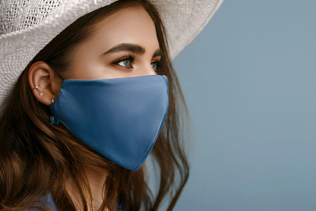 Woman wearing stylish protective face mask